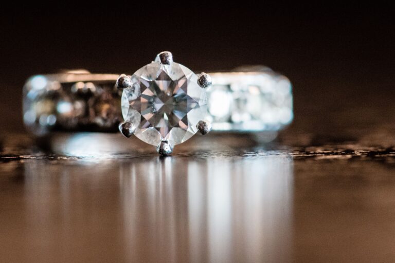 Engagement ring sitting on a table.