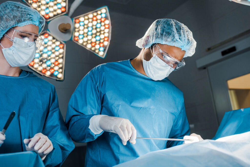 Surgeons performing surgery in a hospital.