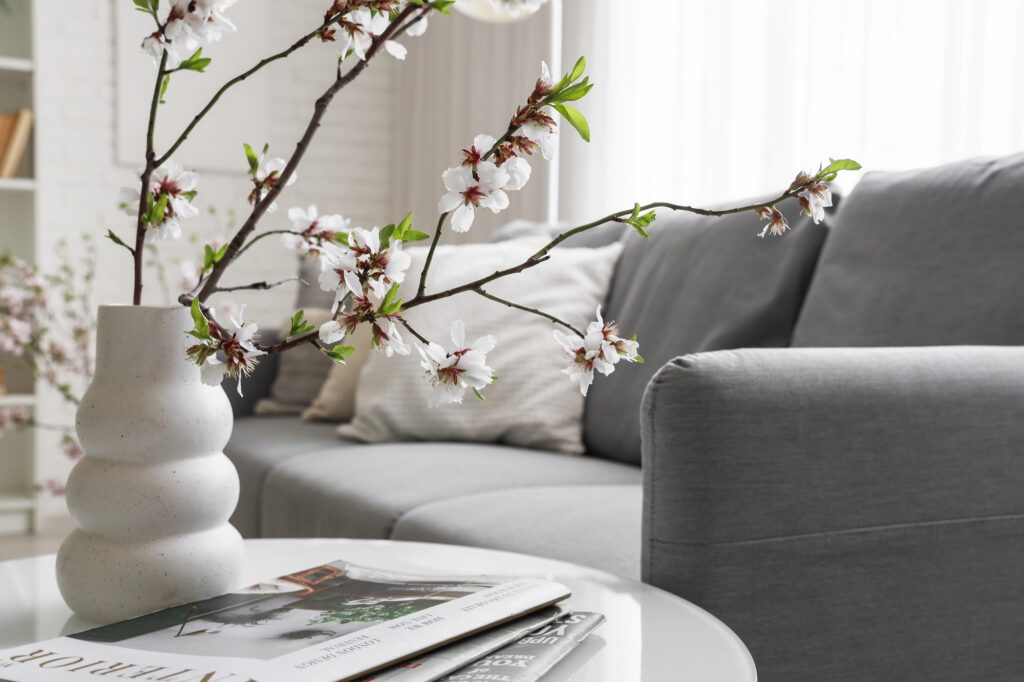 Living room couch and coffee table with decor.