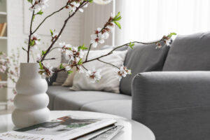 Living room couch and coffee table with decor.