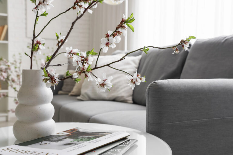 Living room couch and coffee table with decor.