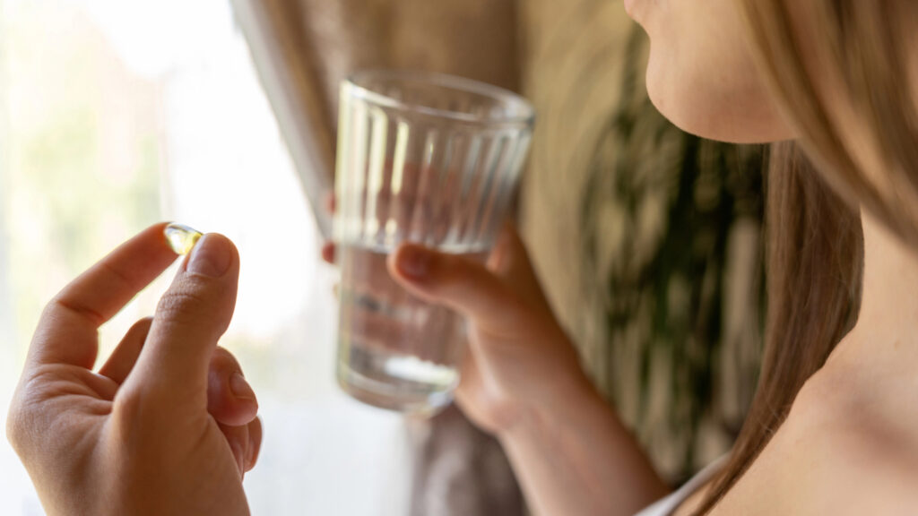 Woman drinking a glass of water.
