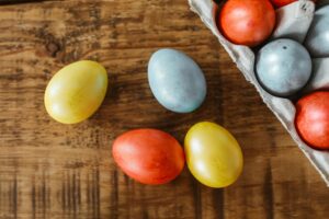 Naturally dyed easter eggs on a table.